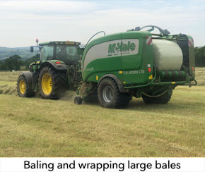 Large round bales are gathered and wrapped at the same time